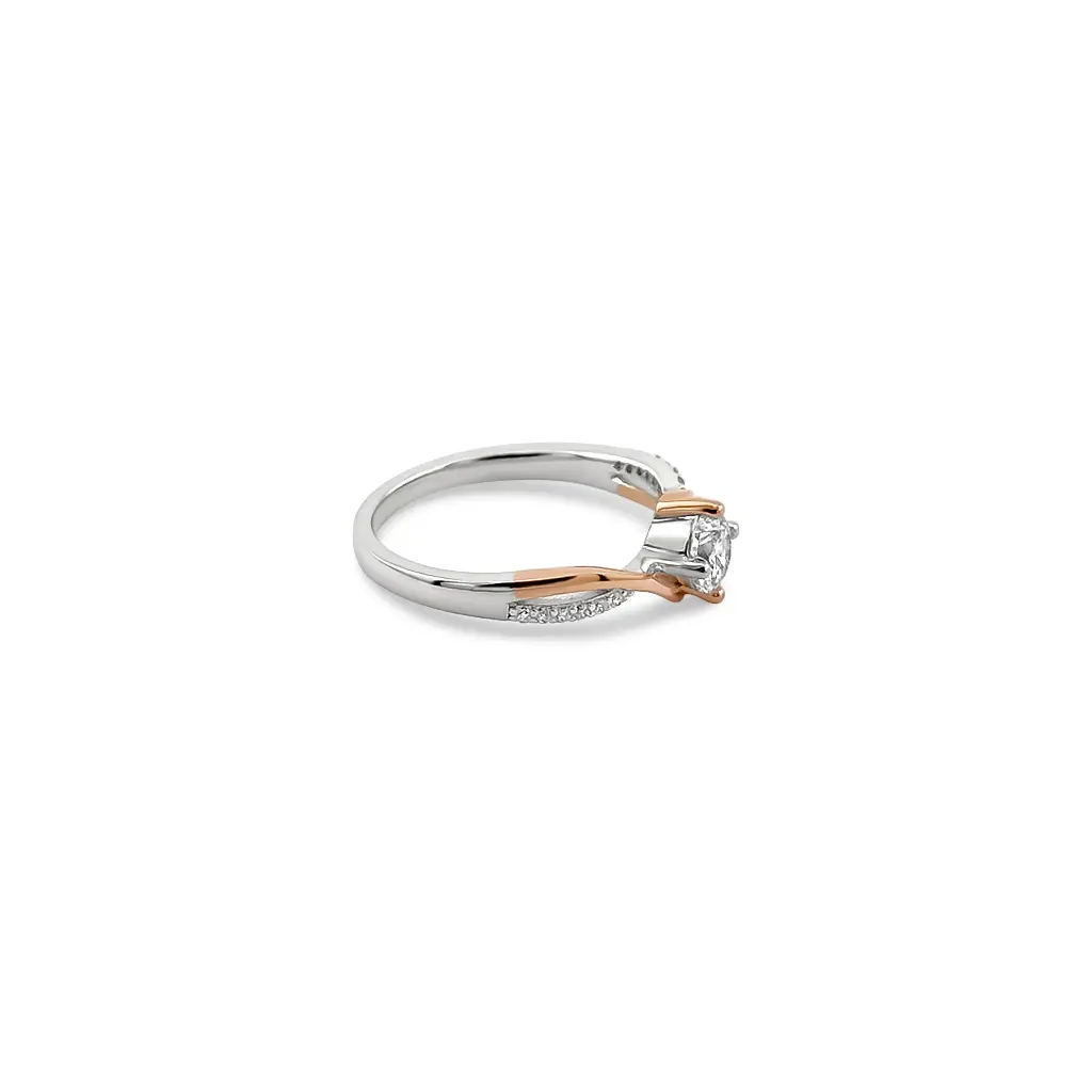 Stunning Two-Tone Diamond Ring with Side Stones and Twist Design